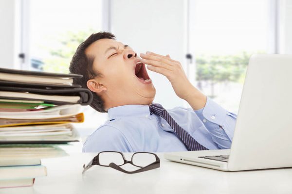 yawning man is struggling with sleep apnea and weight